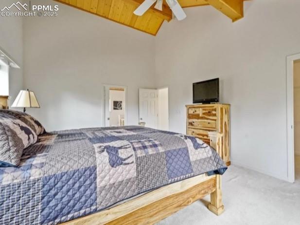 carpeted bedroom featuring beam ceiling, high vaulted ceiling, and ceiling fan