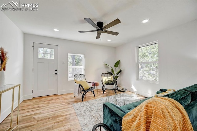 sitting room with recessed lighting, baseboards, a ceiling fan, and light wood finished floors