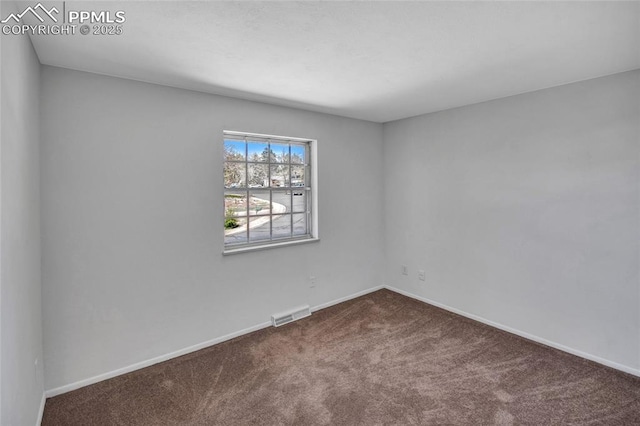 carpeted empty room with baseboards and visible vents