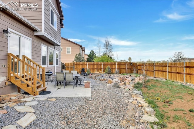 view of yard featuring a patio and a fenced backyard