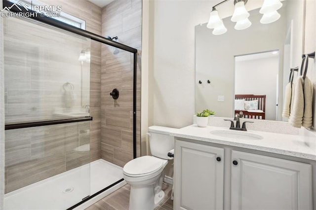 6001 Bennach Grv, Colorado Springs, CO 80927 - ensuite bathroom featuring ensuite bath, a stall shower, toilet, and vanity
