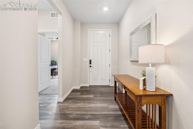6001 Bennach Grv, Colorado Springs, CO 80927 - foyer entrance featuring wood finished floors, visible vents, and baseboards