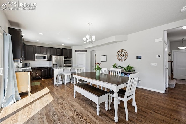 8040 Barraport Dr, Colorado Springs, CO 80908 - dining space featuring baseboards, dark wood-style flooring, an inviting chandelier, and recessed lighting