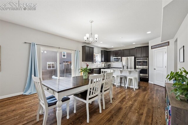 8040 Barraport Dr, Colorado Springs, CO 80908 - dining room with dark wood-style floors, baseboards, a chandelier, and recessed lighting