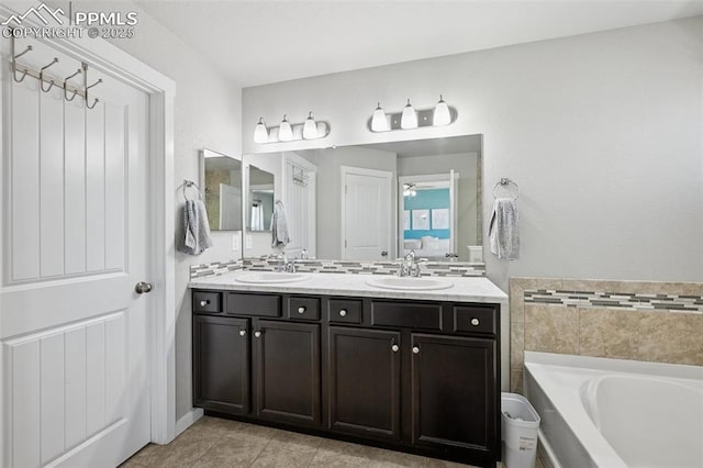 8040 Barraport Dr, Colorado Springs, CO 80908 - bathroom featuring double vanity, a sink, a garden tub, and tile patterned flooring