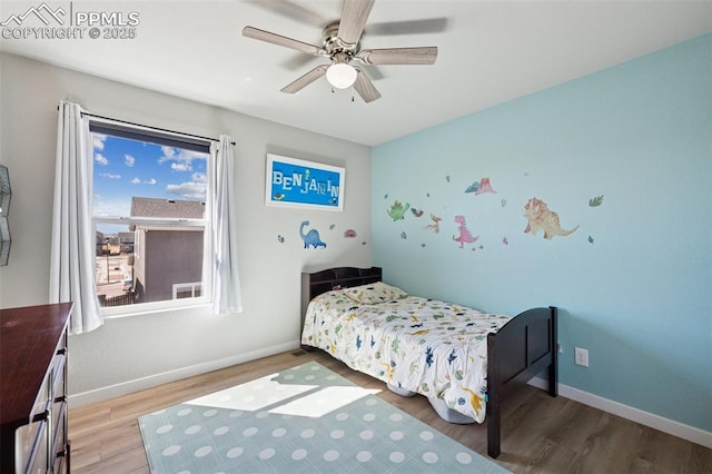 8040 Barraport Dr, Colorado Springs, CO 80908 - bedroom with baseboards, ceiling fan, and wood finished floors