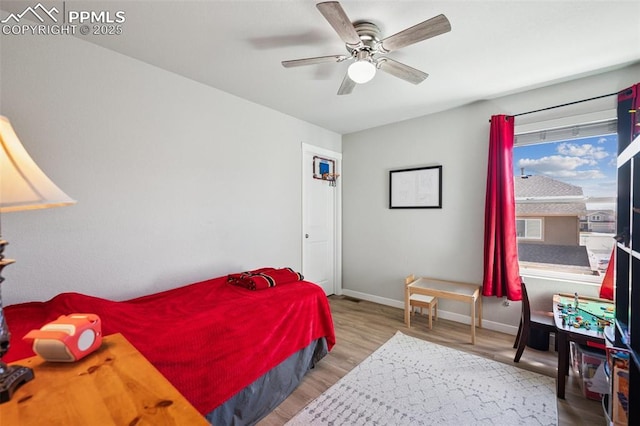 8040 Barraport Dr, Colorado Springs, CO 80908 - bedroom featuring baseboards, ceiling fan, and wood finished floors