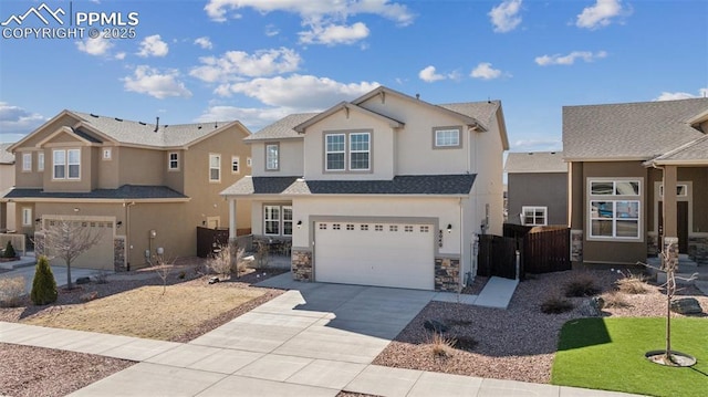 8040 Barraport Dr, Colorado Springs, CO 80908 - view of front of property featuring stucco siding, fence, an attached garage, stone siding, and driveway