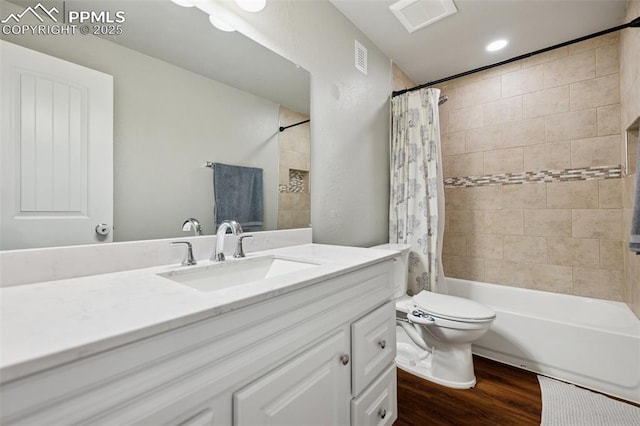 8040 Barraport Dr, Colorado Springs, CO 80908 - bathroom with toilet, vanity, shower / bath combo, wood finished floors, and visible vents