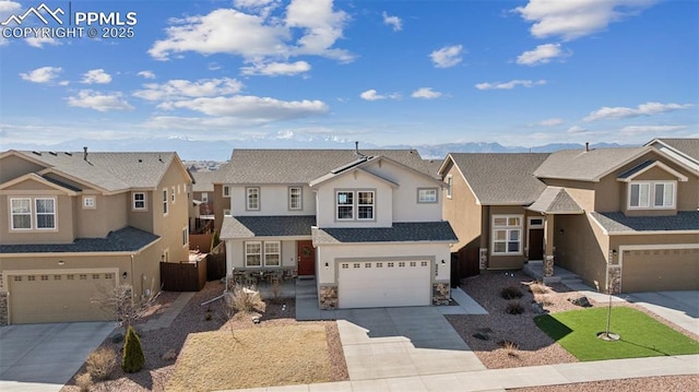 8040 Barraport Dr, Colorado Springs, CO 80908 - traditional-style house with stone siding, a garage, concrete driveway, a residential view, and stucco siding