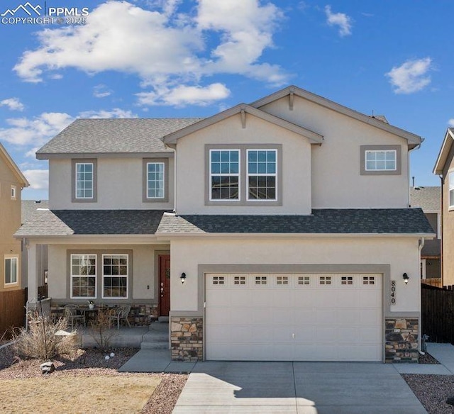 8040 Barraport Dr, Colorado Springs, CO 80908 - view of front of house with concrete driveway, stucco siding, and an attached garage