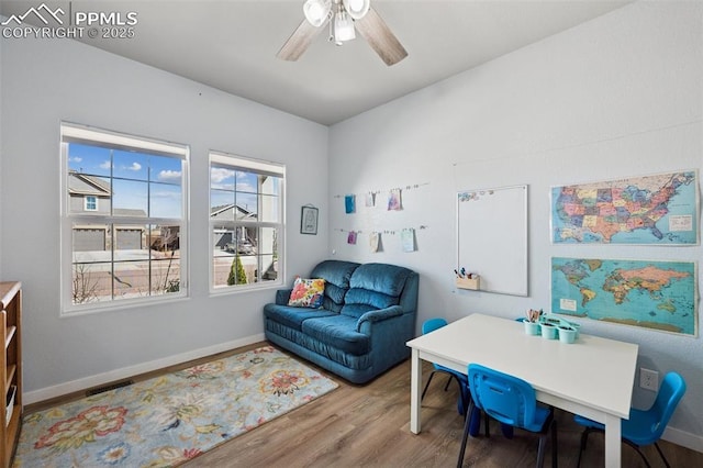 8040 Barraport Dr, Colorado Springs, CO 80908 - interior space featuring baseboards, visible vents, wood finished floors, and a ceiling fan