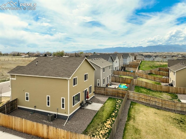 drone / aerial view with a mountain view and a residential view