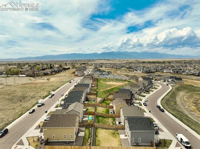 aerial view featuring a residential view and a mountain view