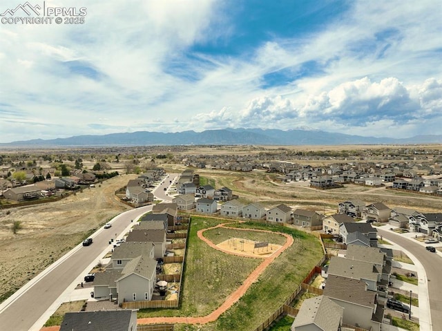 aerial view with a mountain view and a residential view