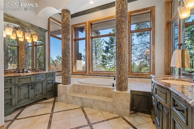 full bathroom featuring two vanities, a sink, crown molding, and a garden tub
