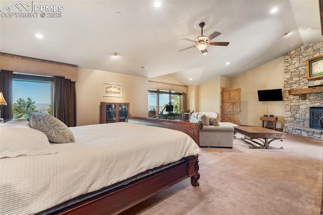 bedroom with visible vents, carpet, a ceiling fan, a stone fireplace, and vaulted ceiling
