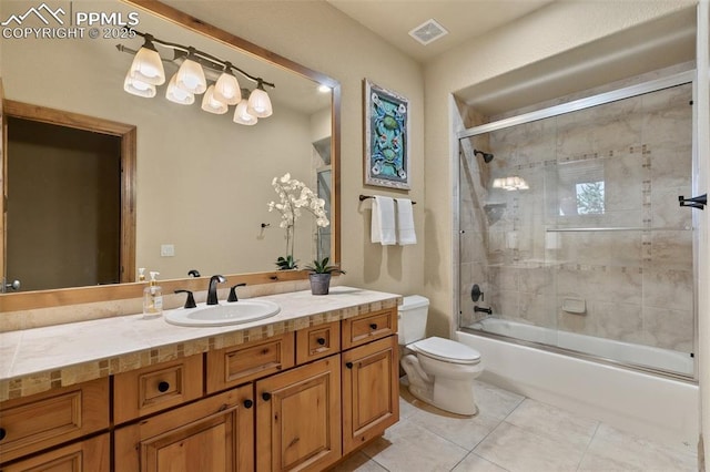full bath featuring visible vents, combined bath / shower with glass door, toilet, tile patterned floors, and vanity