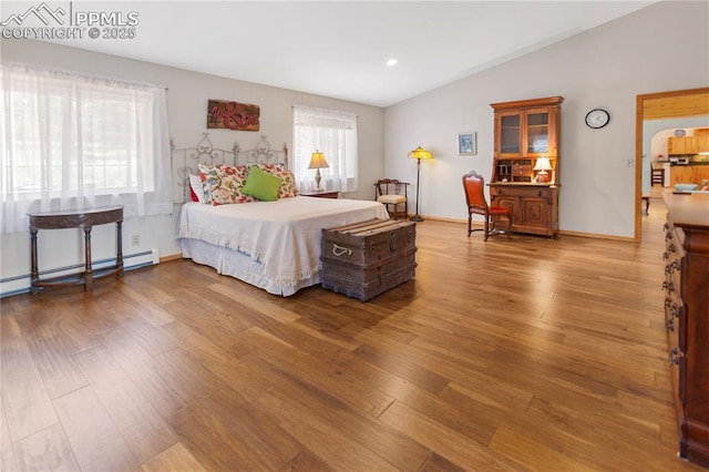 266 University Dr, Woodland Park, CO 80863 - bedroom with wood finished floors, recessed lighting, baseboards, baseboard heating, and vaulted ceiling