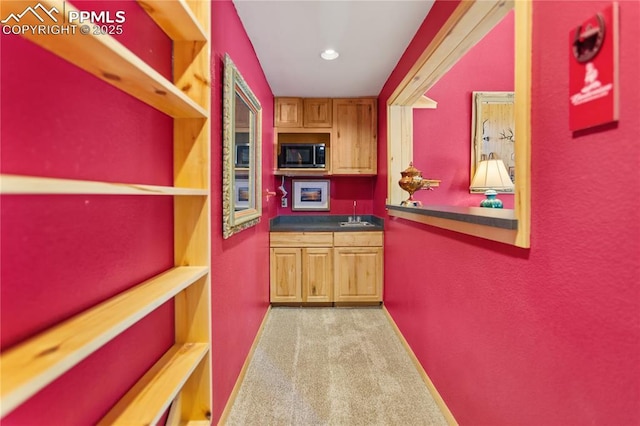 266 University Dr, Woodland Park, CO 80863 - kitchen with baseboards, carpet floors, recessed lighting, a sink, and dark countertops