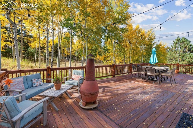 266 University Dr, Woodland Park, CO 80863 - wooden terrace featuring an outdoor living space and outdoor dining space