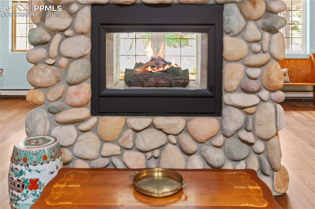 266 University Dr, Woodland Park, CO 80863 - interior details featuring a baseboard radiator and wood finished floors