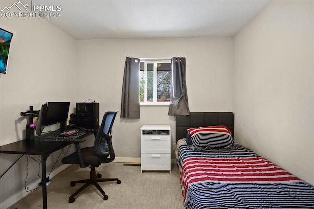 carpeted bedroom featuring baseboards