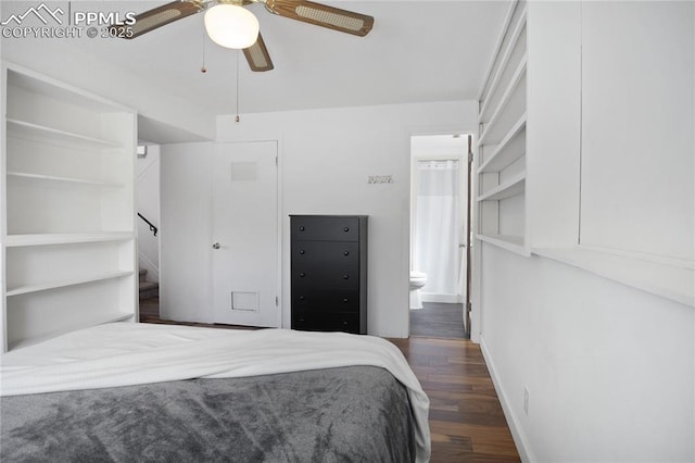 bedroom with visible vents, wood finished floors, baseboards, ceiling fan, and ensuite bath