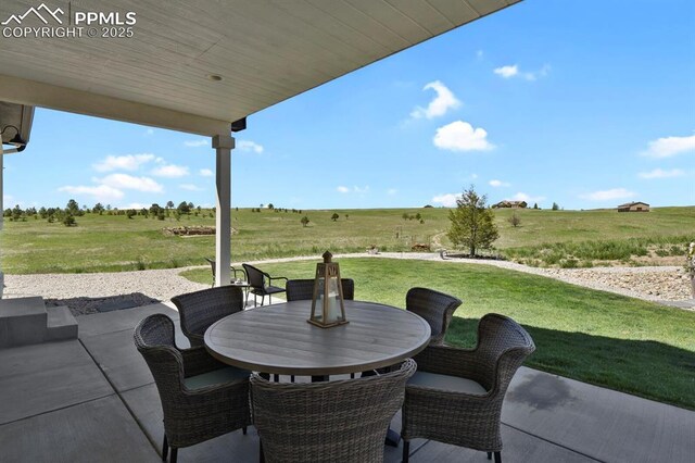 5409 Haes Haven Vw, Colorado Springs, CO 80908 - view of patio / terrace featuring outdoor dining area and a rural view