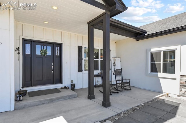 5409 Haes Haven Vw, Colorado Springs, CO 80908 - property entrance featuring covered porch and board and batten siding