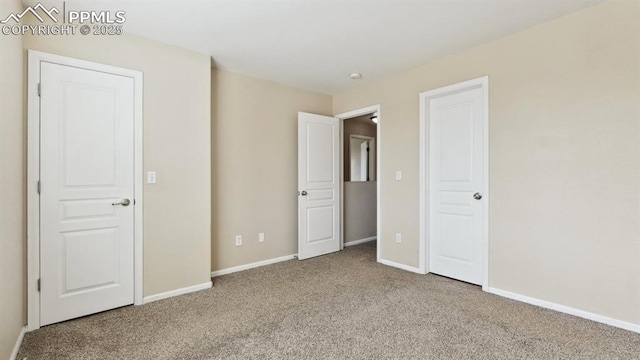 70 Audubon Dr, Colorado Springs, CO 80910 - unfurnished bedroom with baseboards and carpet