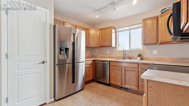 70 Audubon Dr, Colorado Springs, CO 80910 - kitchen with light countertops, visible vents, light floors, appliances with stainless steel finishes, and a sink