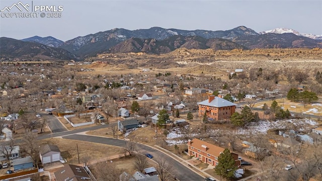 drone / aerial view featuring a residential view and a mountain view