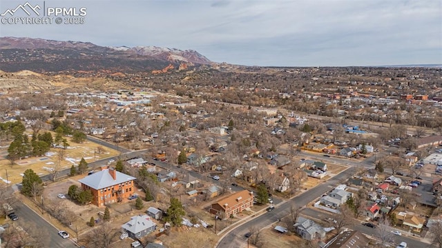 birds eye view of property featuring a mountain view and a residential view