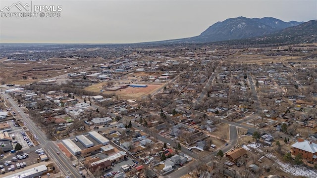birds eye view of property with a mountain view