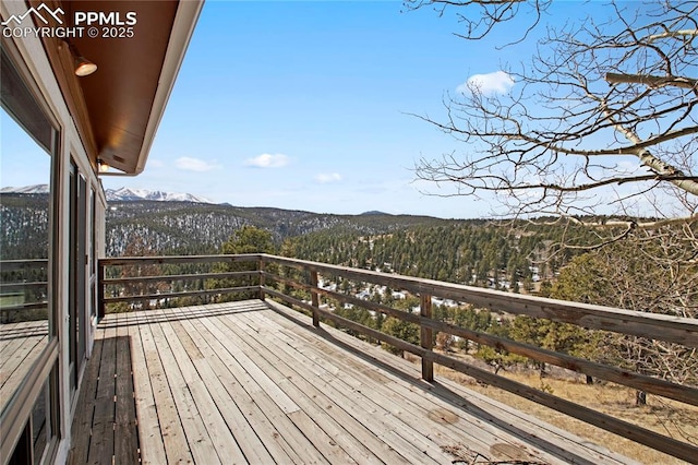 wooden terrace with a mountain view