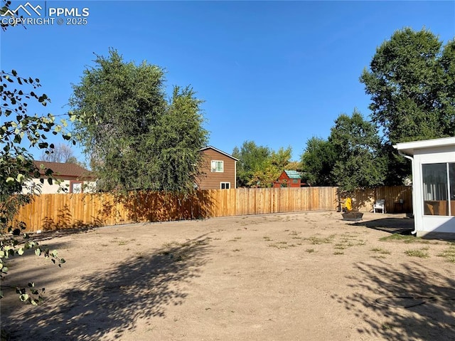 view of yard with a fenced backyard