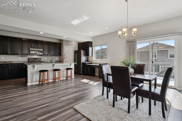 1632 Derbyshire St, Colorado Springs, CO 80910 - dining room with dark wood-style flooring, recessed lighting, and a chandelier