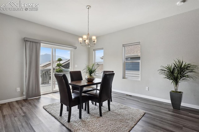 1632 Derbyshire St, Colorado Springs, CO 80910 - dining room featuring baseboards, a notable chandelier, visible vents, and dark wood-style flooring