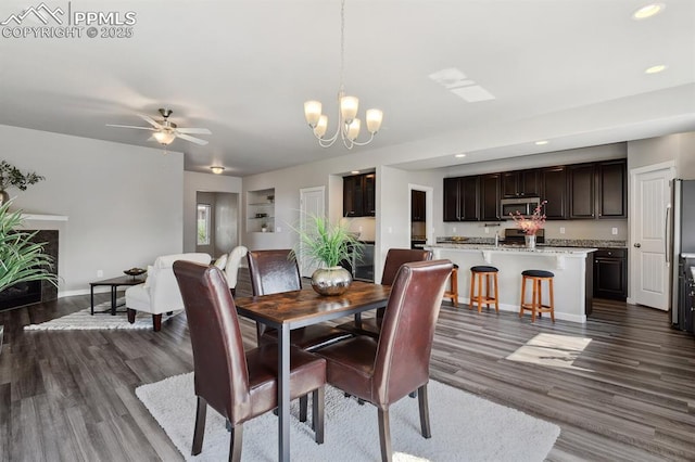 1632 Derbyshire St, Colorado Springs, CO 80910 - dining area featuring dark wood finished floors, ceiling fan with notable chandelier, recessed lighting, and baseboards