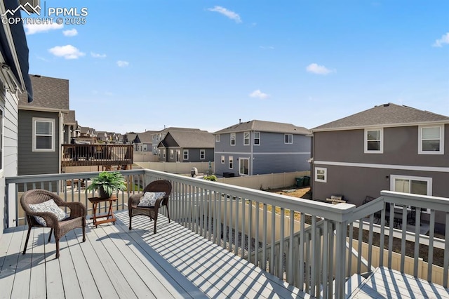1632 Derbyshire St, Colorado Springs, CO 80910 - wooden deck featuring a residential view