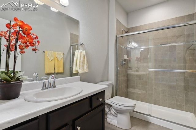 1632 Derbyshire St, Colorado Springs, CO 80910 - bathroom featuring toilet, vanity, and a stall shower