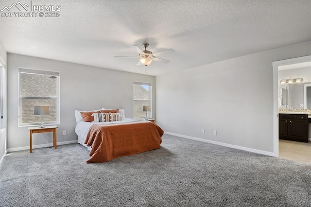 1632 Derbyshire St, Colorado Springs, CO 80910 - unfurnished bedroom featuring light carpet, baseboards, ensuite bathroom, and a textured ceiling