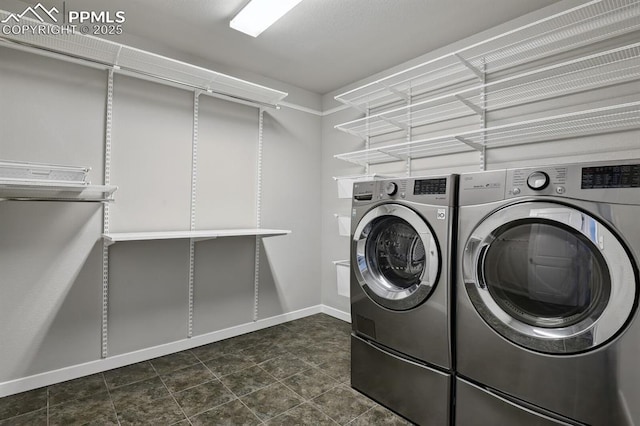 1632 Derbyshire St, Colorado Springs, CO 80910 - clothes washing area with separate washer and dryer, baseboards, and laundry area
