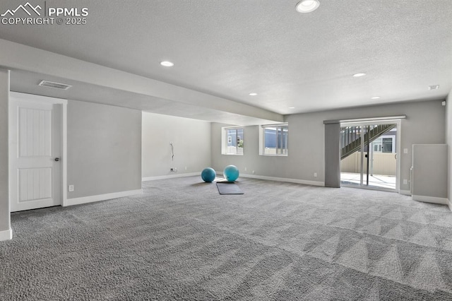 1632 Derbyshire St, Colorado Springs, CO 80910 - exercise room featuring baseboards, visible vents, carpet flooring, and a textured ceiling