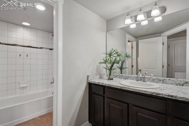 1632 Derbyshire St, Colorado Springs, CO 80910 - full bathroom with tile patterned floors, vanity, and washtub / shower combination