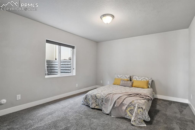 1632 Derbyshire St, Colorado Springs, CO 80910 - carpeted bedroom with baseboards and a textured ceiling