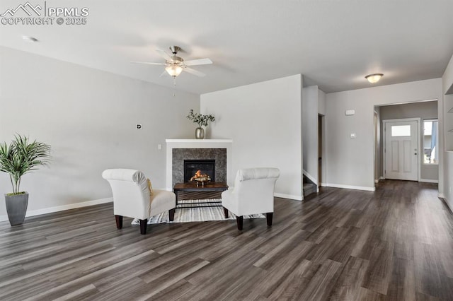 1632 Derbyshire St, Colorado Springs, CO 80910 - living area featuring baseboards, ceiling fan, a high end fireplace, and wood finished floors