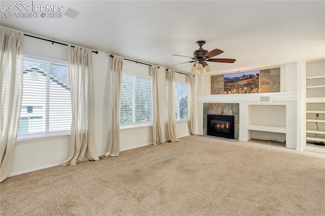 4730 Jenson Ln, Colorado Springs, CO 80922 - unfurnished living room featuring plenty of natural light, carpet flooring, and a ceiling fan
