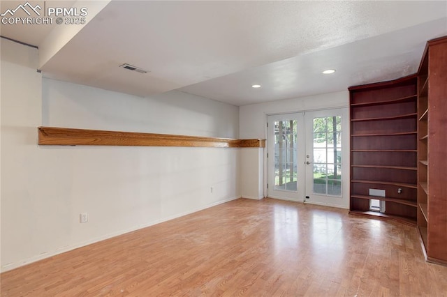 4730 Jenson Ln, Colorado Springs, CO 80922 - empty room with french doors, wood finished floors, baseboards, and recessed lighting